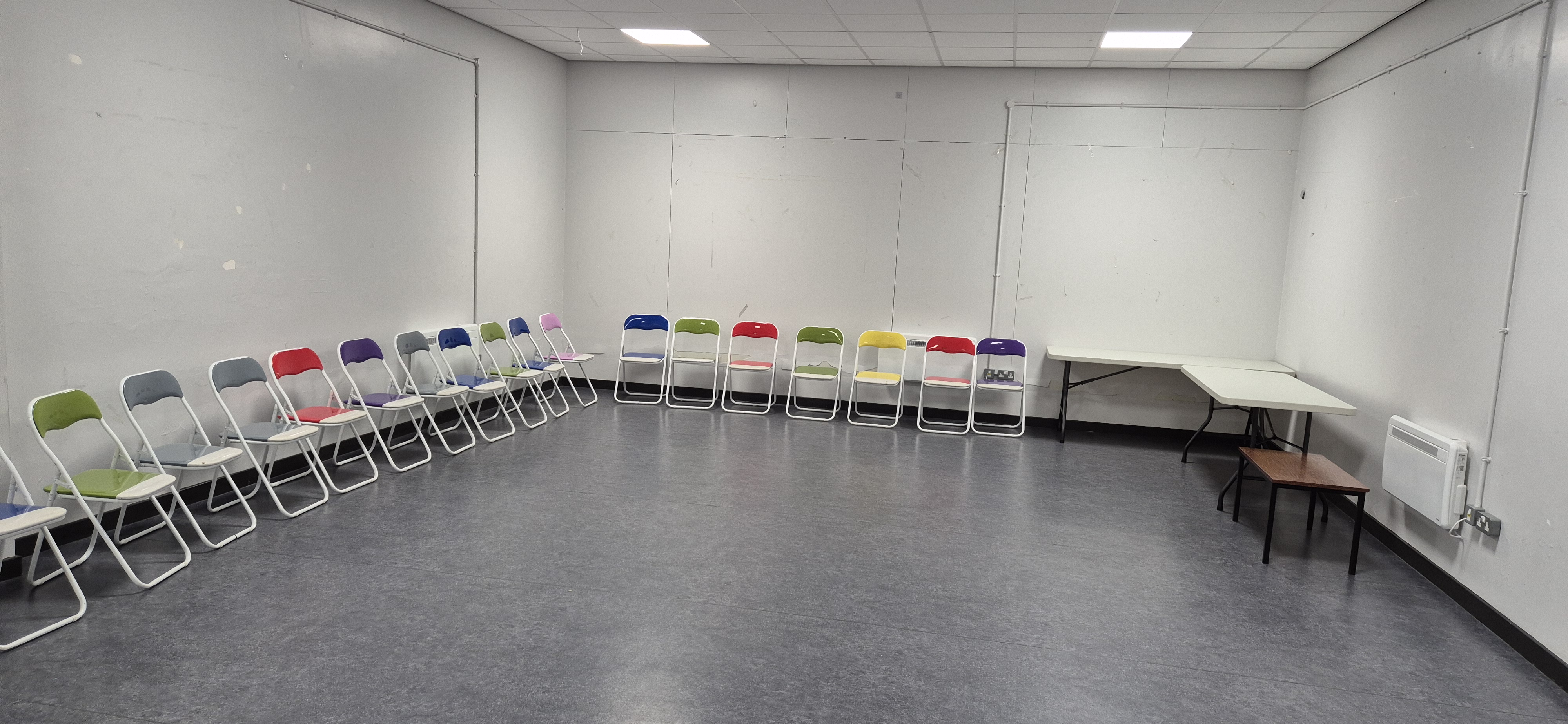 Party Room at Whitburn Community Centre — bright room with colourful folding chairs arranged in a semicircle, adjacent to the Soft Play area