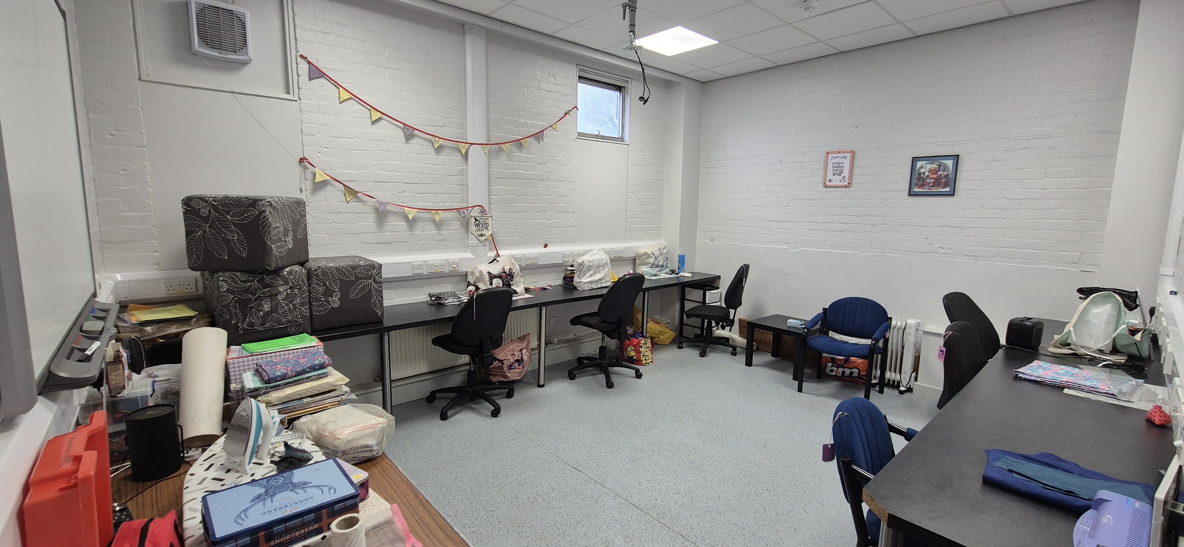 Craft Room at Whitburn Community Centre — practical workroom with continuous bench surfaces, task chairs, and natural light, suitable for craft groups and creative activities
